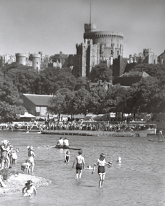 Children frolicking in the Thames with Windsor Castle in the distance, Windsor, Berkshire c1930s