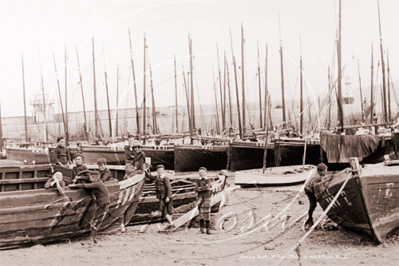 Young lads playing by the fishing boats on the beach, St Ive's in Cornwall c1900s