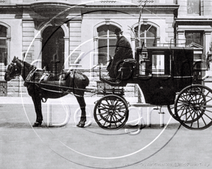 Cab Driver on his 4 Wheeler "Growler" Cab outside the Royal Collonial Club in London c1903