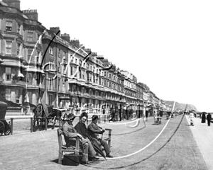 St Leonards Esplanade with Victorian men posing for the photographer in Sussex c1890s