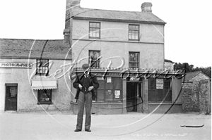Picture of Cornwall - St Just, Market Square Post Office and man standing in road c1900s - N2676